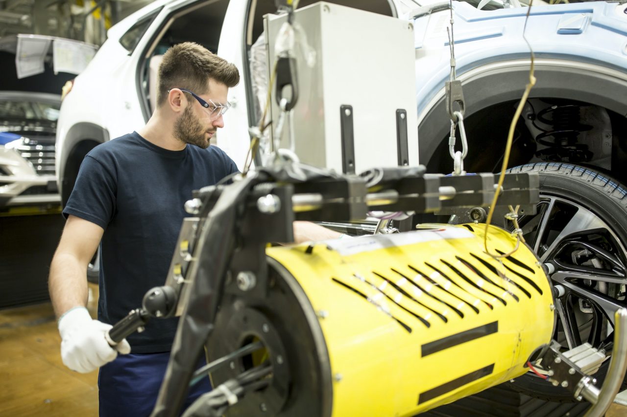 man-working-in-modern-car-factory.jpg